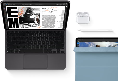 iPad Pro attached to Magic Keyboard, front exterior, space black colour, rounded corners, black display bezel, open, display showing article editing app with text and photograph of a woman playing music, Airpods 4 in open case, blue Smart Folio cover on iPad Pro with Apple Pencil Pro resting atop device, cover slightly open revealing display