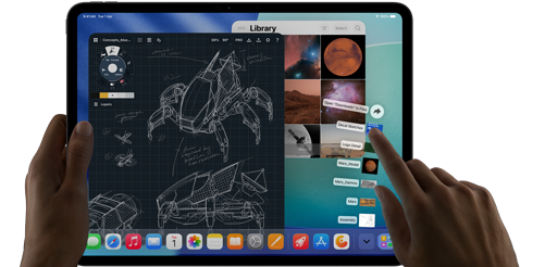 iPad Pro, space black colour, left hand holding device, right hand pointing gesturing to manipulate multiple open app windows, a drawing app with sketches of mechanical designs, photos library of planets and space images, downloads folder files fanned out
