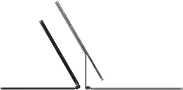 Two iPad Pro devices attached to Magic Keyboard, side exterior, thin profile, space black colour with speakers and USB-C port, tilted half open, silver colour, open, tilted back showing the keyboard’s floating cantilever design, speakers and microphone