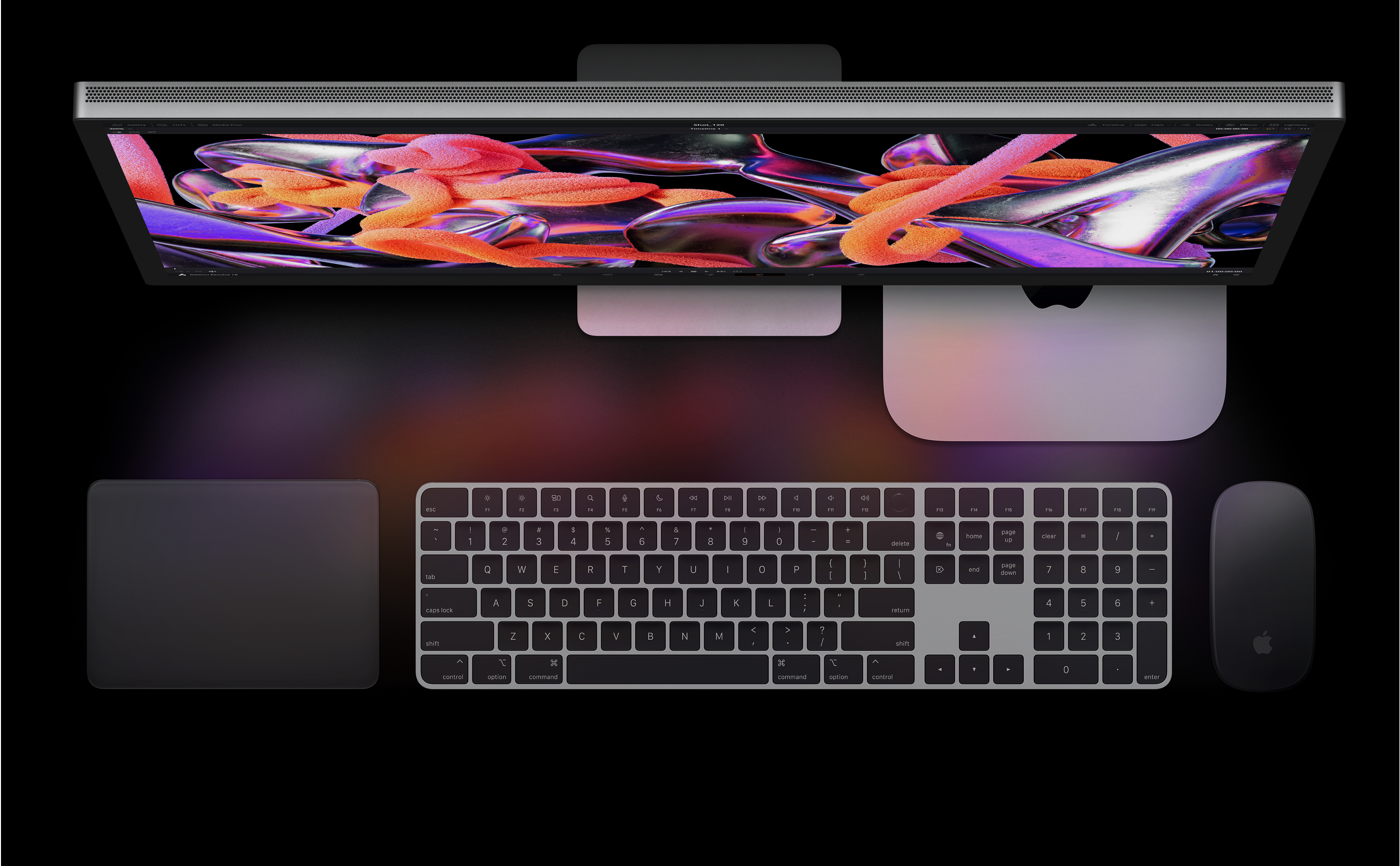 Top view of Studio Display, Mac mini, Magic Trackpad, Magic Keyboard and Magic Mouse.