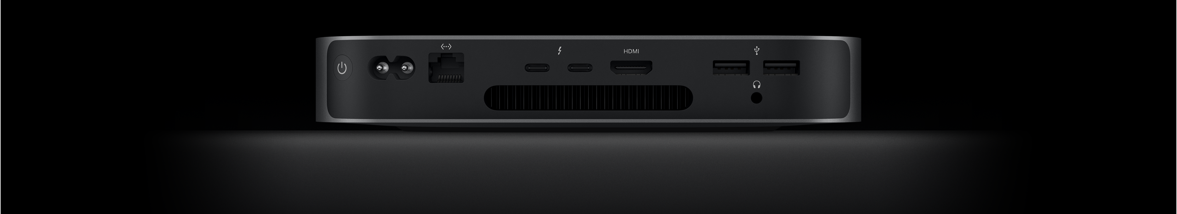Back view of Mac mini showing the two Thunderbolt 4 ports, HDMI port, two USB-A ports, headphone jack, Gigabit Ethernet port, power port and power button.